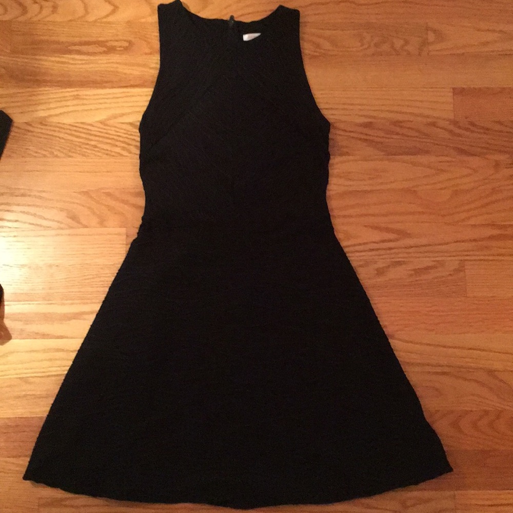 Black mini skater dress with raised detailing